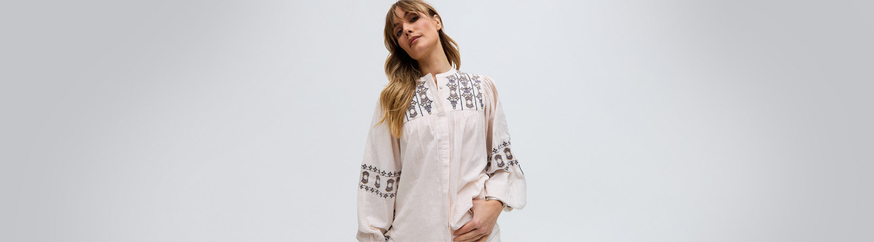 desktop image showing model wearing Demi blouse