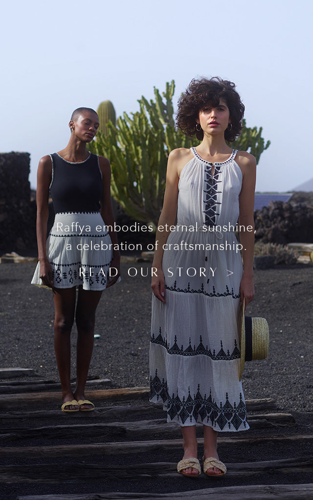 Model on the left styles our Biba Blanket Stitch Sleeveless Top In Black, with our Estella Tiered Embroidered Mini Skirt In Cream. Model on the right wears the Mia Embroidered Maxi Dress In White. Copy on image 'Raffya embodies eternal sunshine, a celebration of craftsmanship - Read Our Story'.