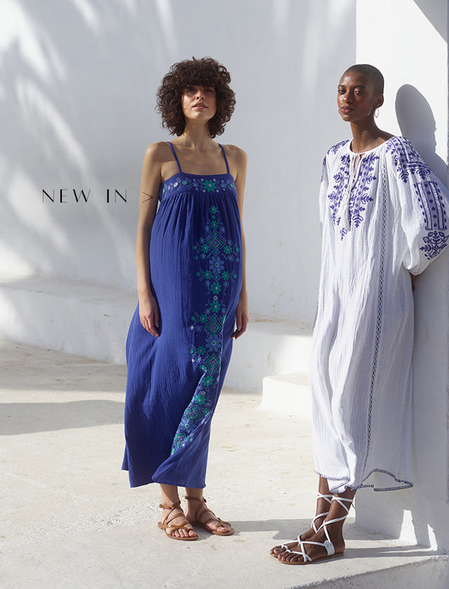 Model on left wears our Thea Spaghetti Strap Embroidered Maxi Dress In Blue. Model on the right styles our Aurelia Kaftan Style Embroidered Maxi Dress In White. Copy on image 'New In'.