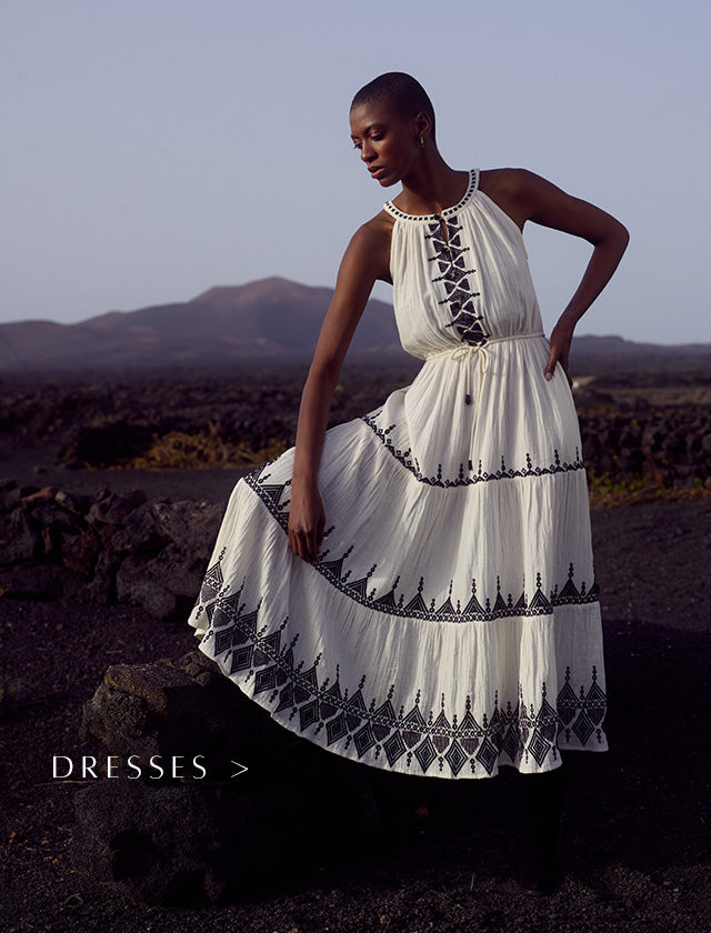 Model wears Mia Wrap Embroidered Maxi Dress In White. Copy on image 'Dresses'