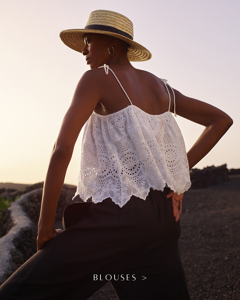 White embroidered cami with tie detail on shoulders. Copy on image 'Blouses'