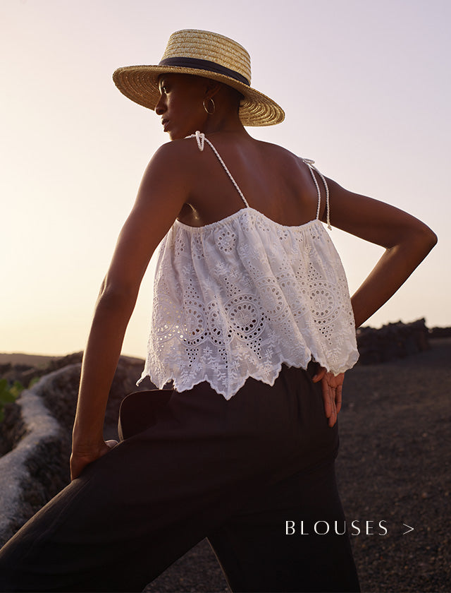 White embroidered cami with tie detail on shoulders. Copy on image 'Blouses'