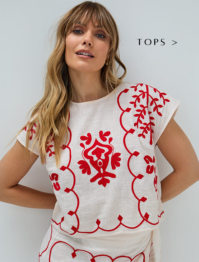 Model wears our Fraya Cross Hatch Embroidered Crop Top In White. Copy on image 'Shop Tops'.