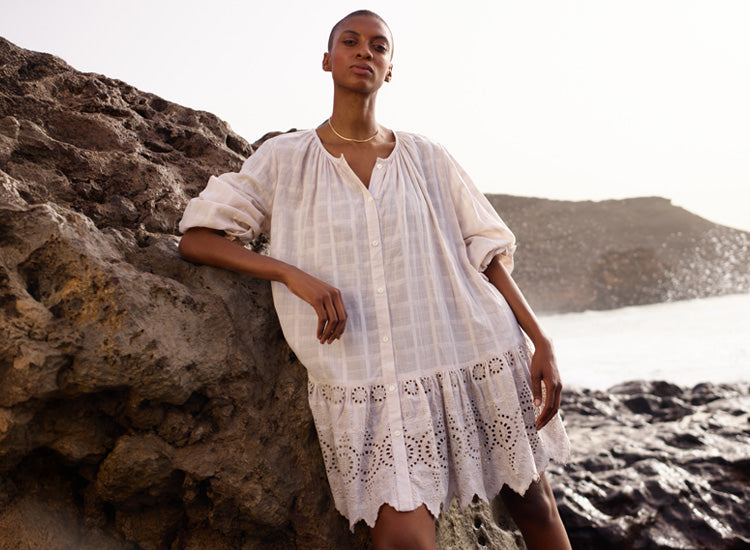 Model wears our Olivia Button Down Embroidered Mini Dress In Cream