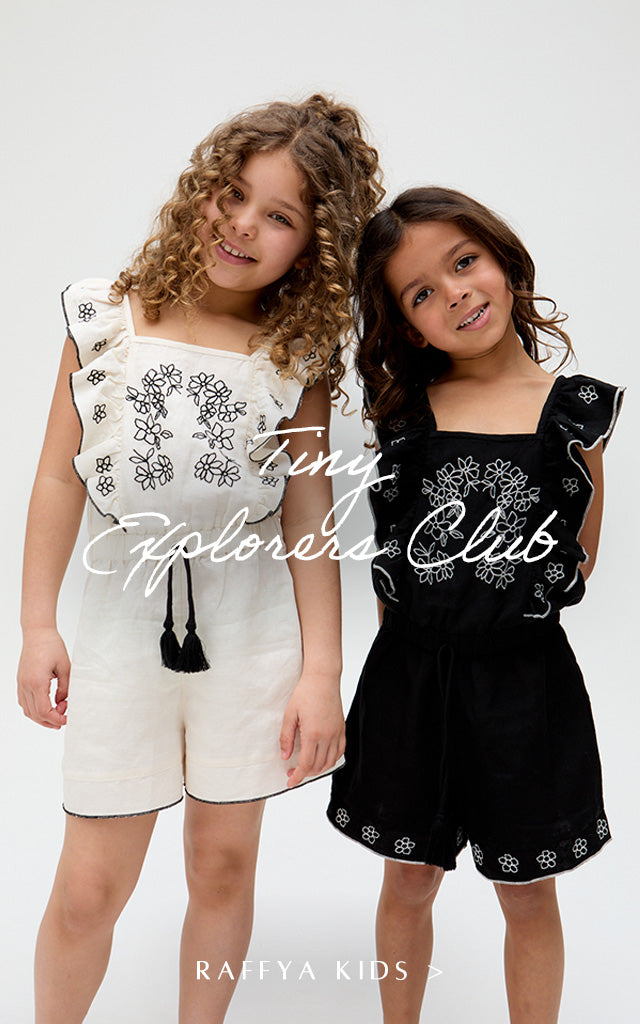 Kids Philo Ruffle Neck Embroidered Playsuit In White and matching Kids Philo Ruffle Neck Embroidered Playsuit In Black. Copy on image 'Tiny Explorers Club - Shop Raffya Kids'.