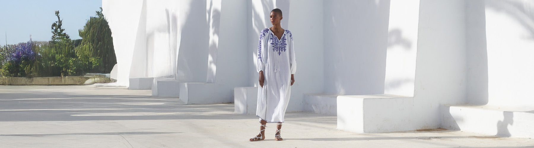 Model wears our Aurelia Kaftan Style Embroidered Maxi Tunic Dress In White