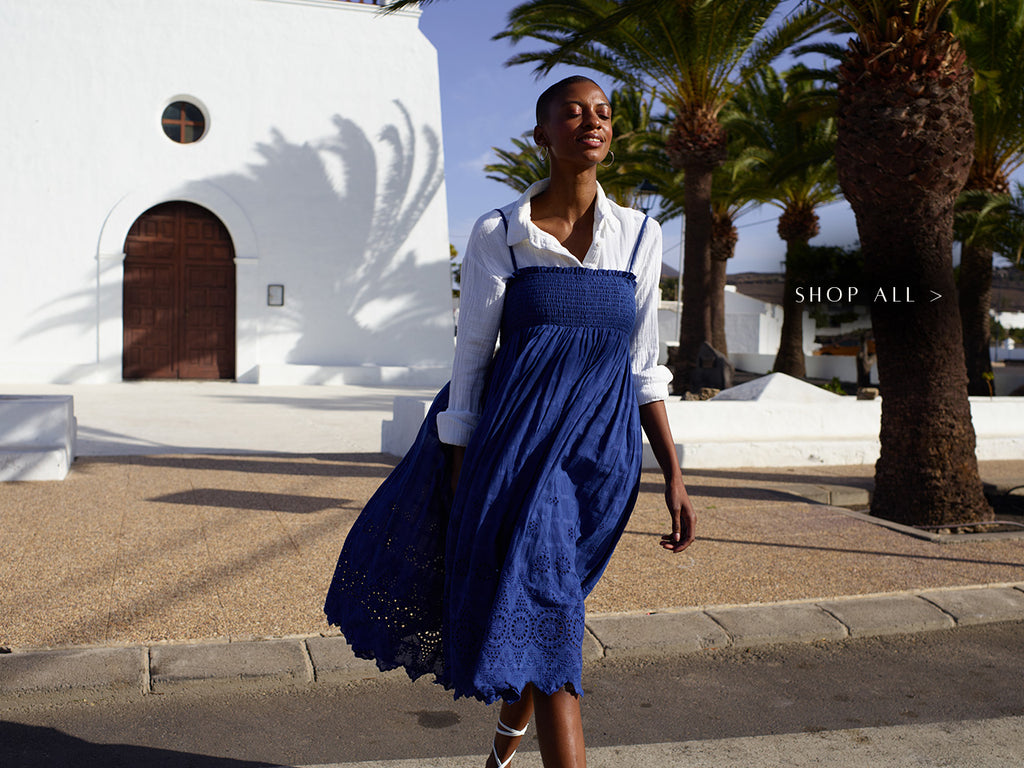 Model wears our Mirella Detachable Straps Embroidered Midi Dress In Blue. Copy on image 'Shop All'.