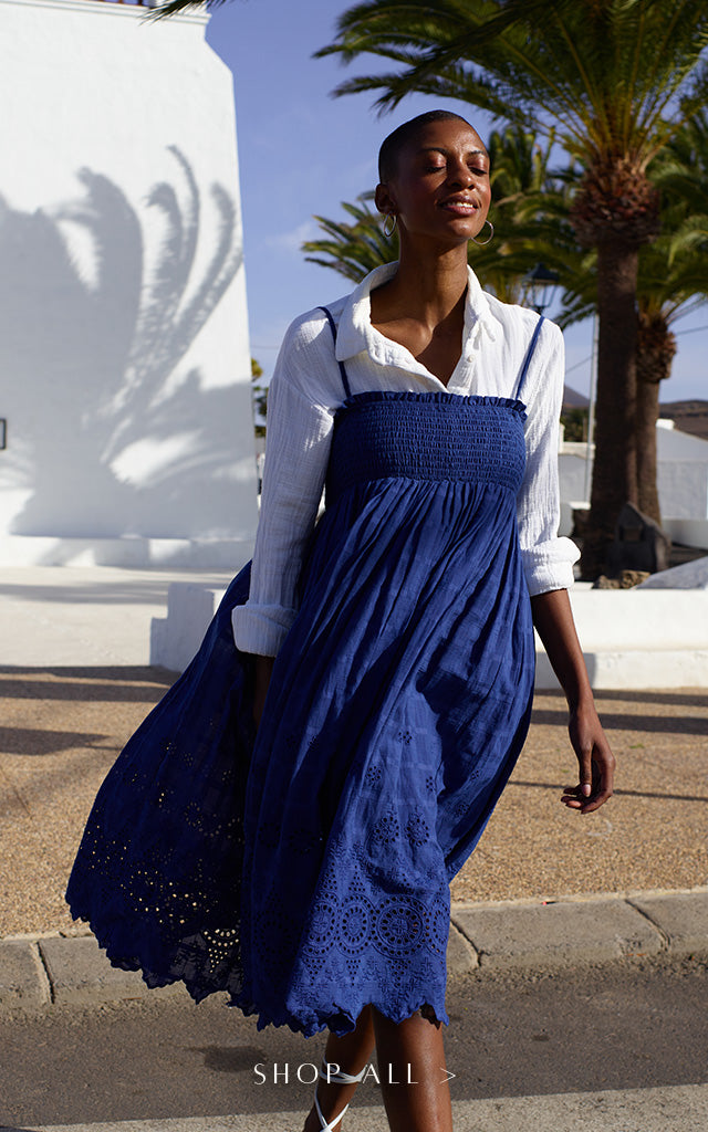 Model wears our Mirella Detachable Straps Embroidered Midi Dress In Blue. Copy on image 'Shop All'.