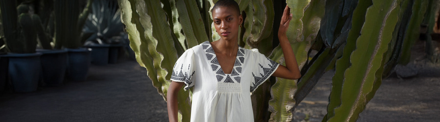 model wearing embroidered dress - desktop