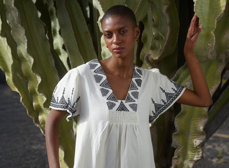 model wearing embroidered dress - mobile