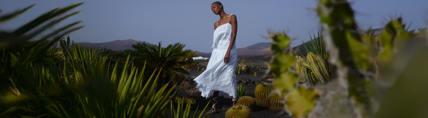 Model styles the Rufa Spaghetti Strap Embroidered Cami In White with our matching Mirella Smocked Waist Embroidered Midi Skirt In White