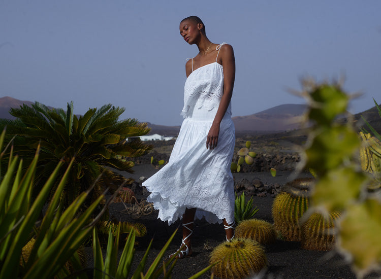 Model styles the Rufa Spaghetti Strap Embroidered Cami In White with our matching Mirella Smocked Waist Embroidered Midi Skirt In White