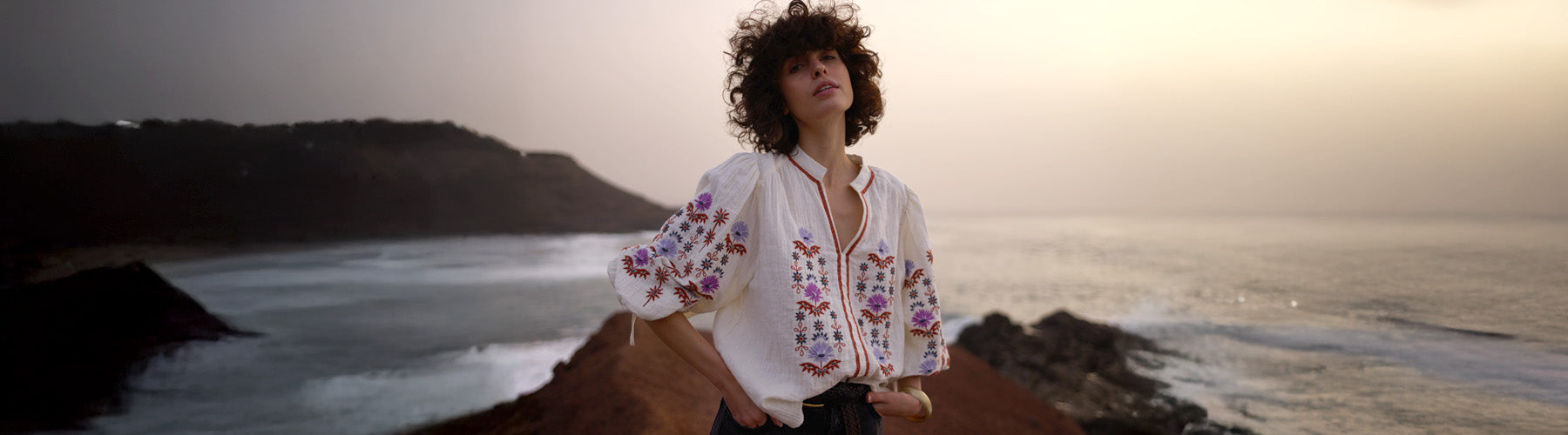 Model styles our Dina V-Neck Embroidered Shirt In Cream