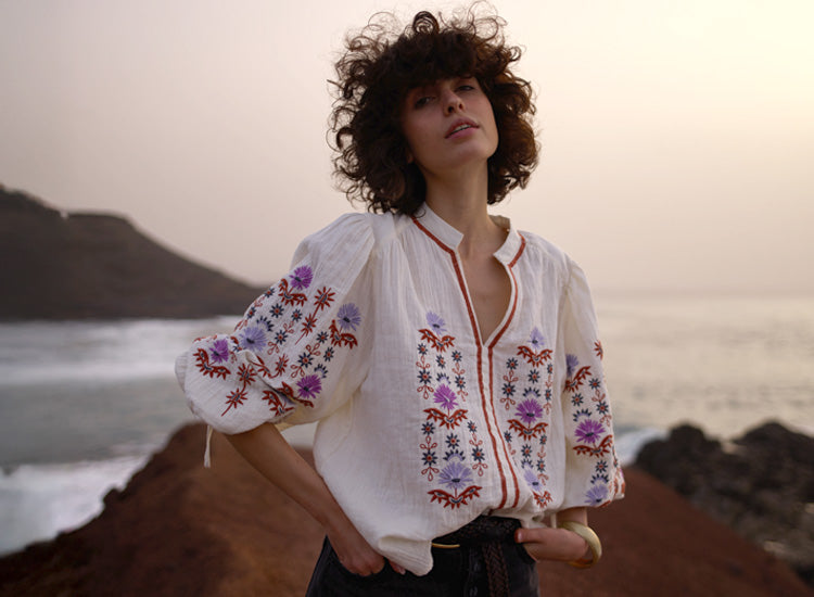 Model styles our Dina V-Neck Embroidered Shirt In Cream